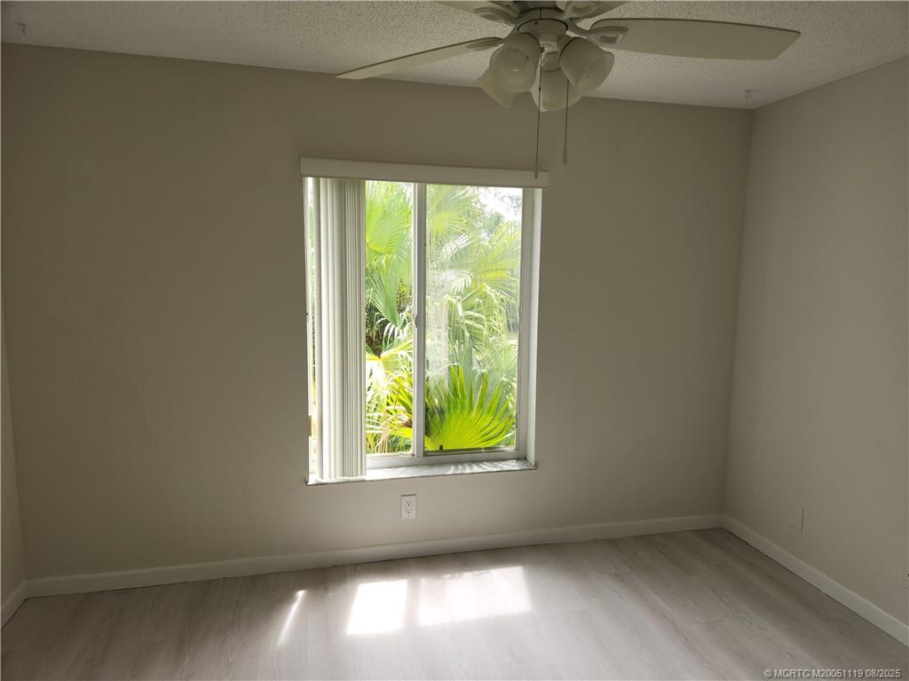 2502 Southeast Anchorage Cove, Unit H2 Port St. Lucie, FL 34952 - Photo 21 of 37 an empty room with a window