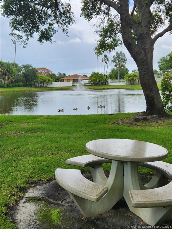 2502 Southeast Anchorage Cove, Unit H2 Port St. Lucie, FL 34952 - Photo 33 of 37 a view of yard with furniture and lake view