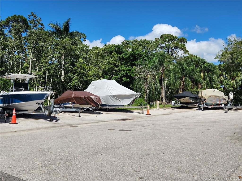 2502 Southeast Anchorage Cove, Unit H2 Port St. Lucie, FL 34952 - Photo 34 of 37 a view of a street with cars parked