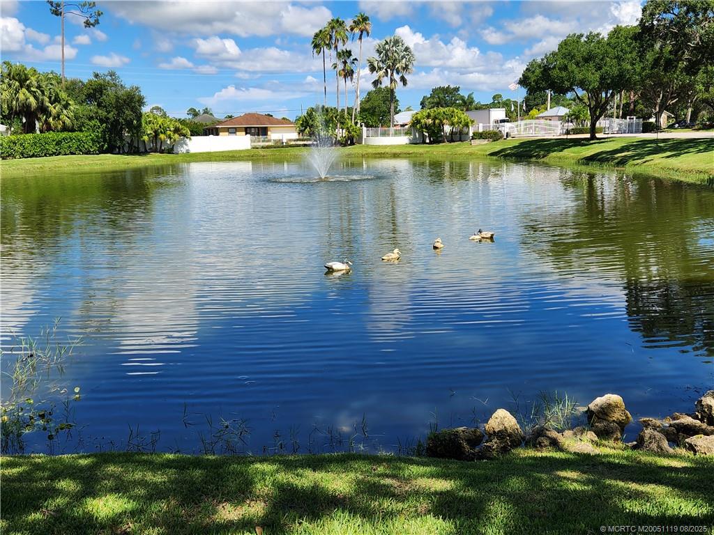 2502 Southeast Anchorage Cove, Unit H2 Port St. Lucie, FL 34952 - Photo 5 of 37 a view of a lake with outdoor space