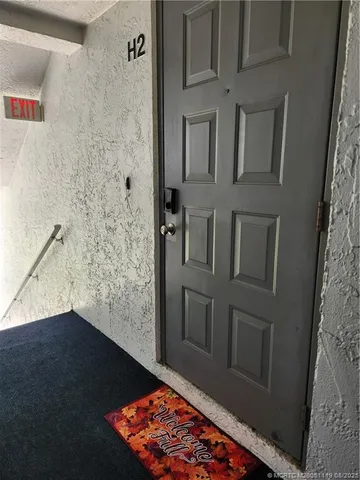 a view of a balcony with chairs