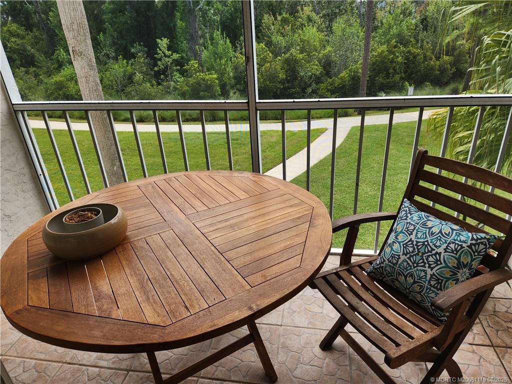 2502 Southeast Anchorage Cove, Unit H2 Port St. Lucie, FL 34952 - Photo 9 of 37 a view of a balcony with chairs