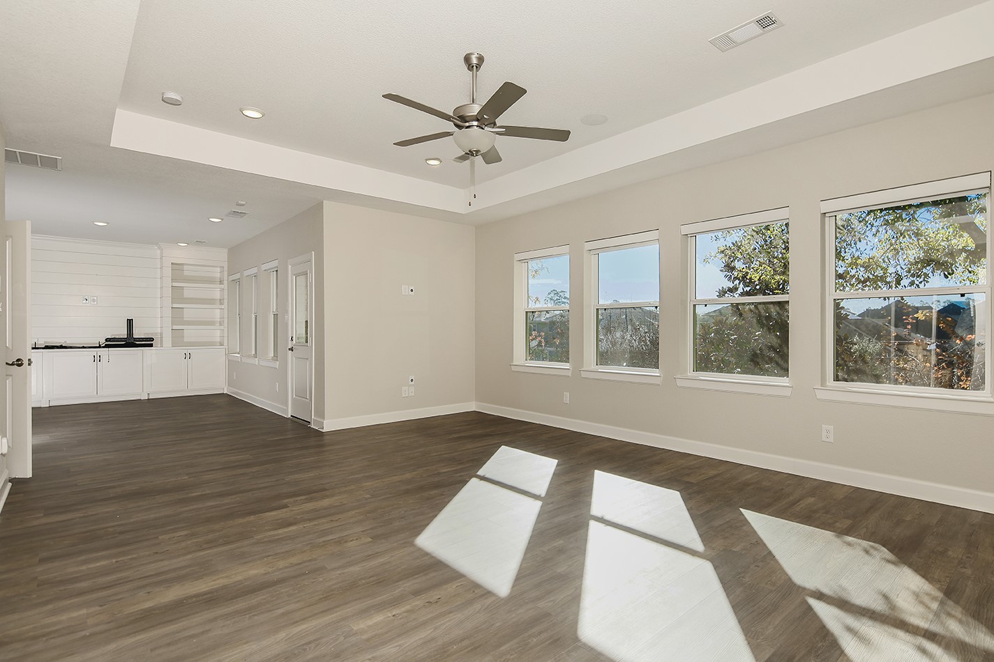 543 Kingston Lane Conroe, TX 77384 - Photo 15 of 33 a view of an empty room with wooden floor and a window