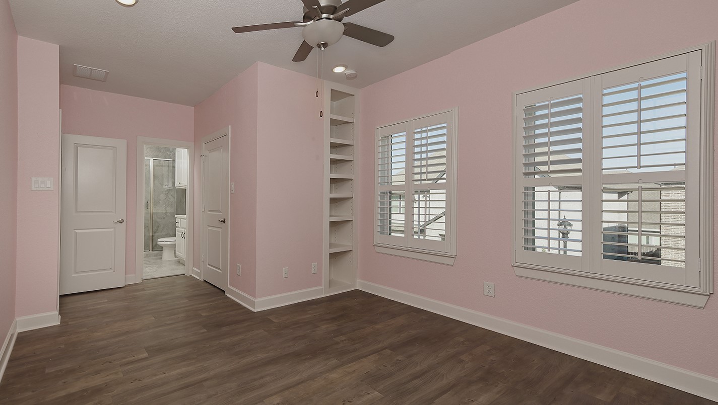 543 Kingston Lane Conroe, TX 77384 - Photo 29 of 33 a view of an empty room with wooden floor and a window