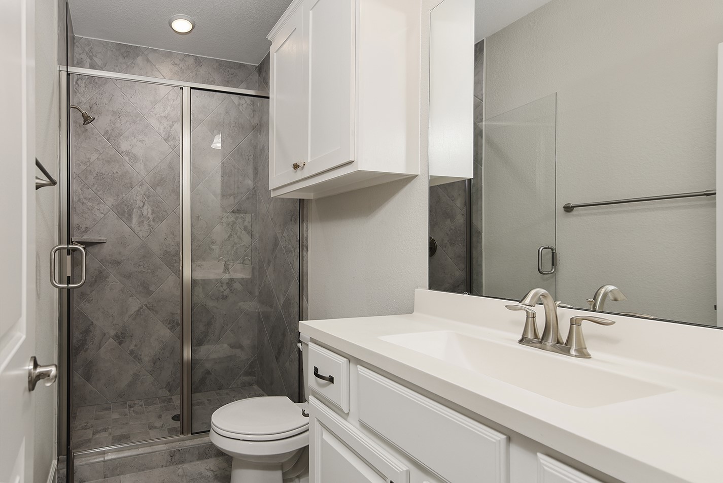 543 Kingston Lane Conroe, TX 77384 - Photo 30 of 33 a bathroom with a sink a toilet and shower