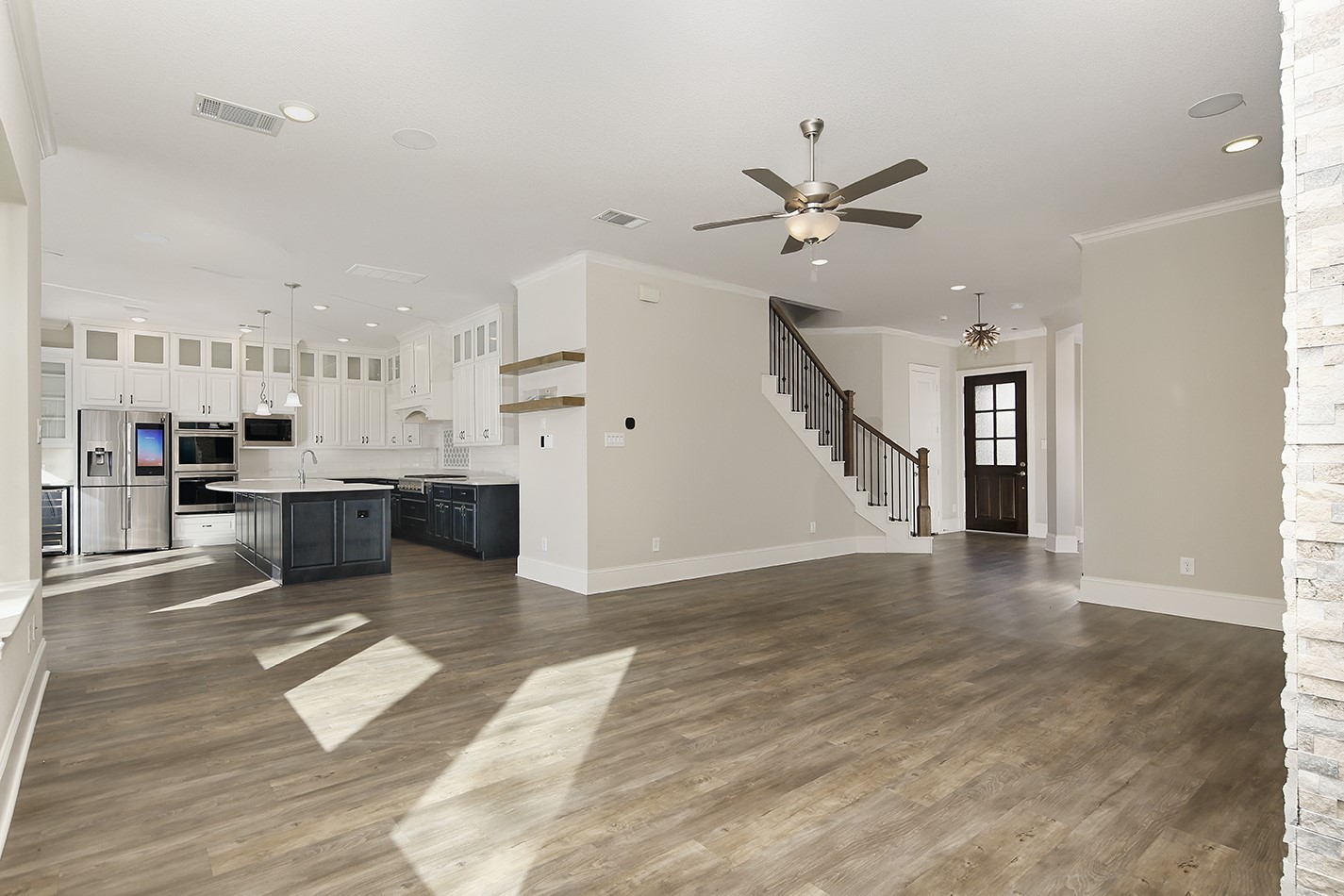 543 Kingston Lane Conroe, TX 77384 - Photo 9 of 33 a view of kitchen with cabinets and wooden floor
