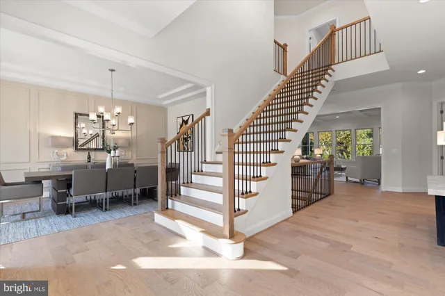 a bathroom with a shower sink vanity mirror and toilet