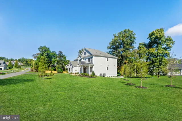 a living room with furniture fireplace and window