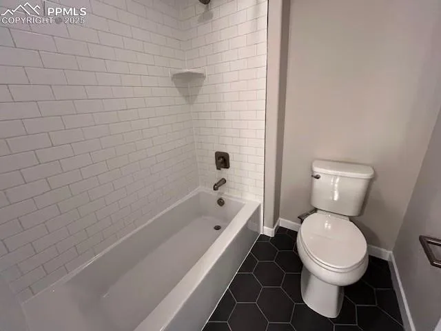 a bathroom with a toilet and a bathtub