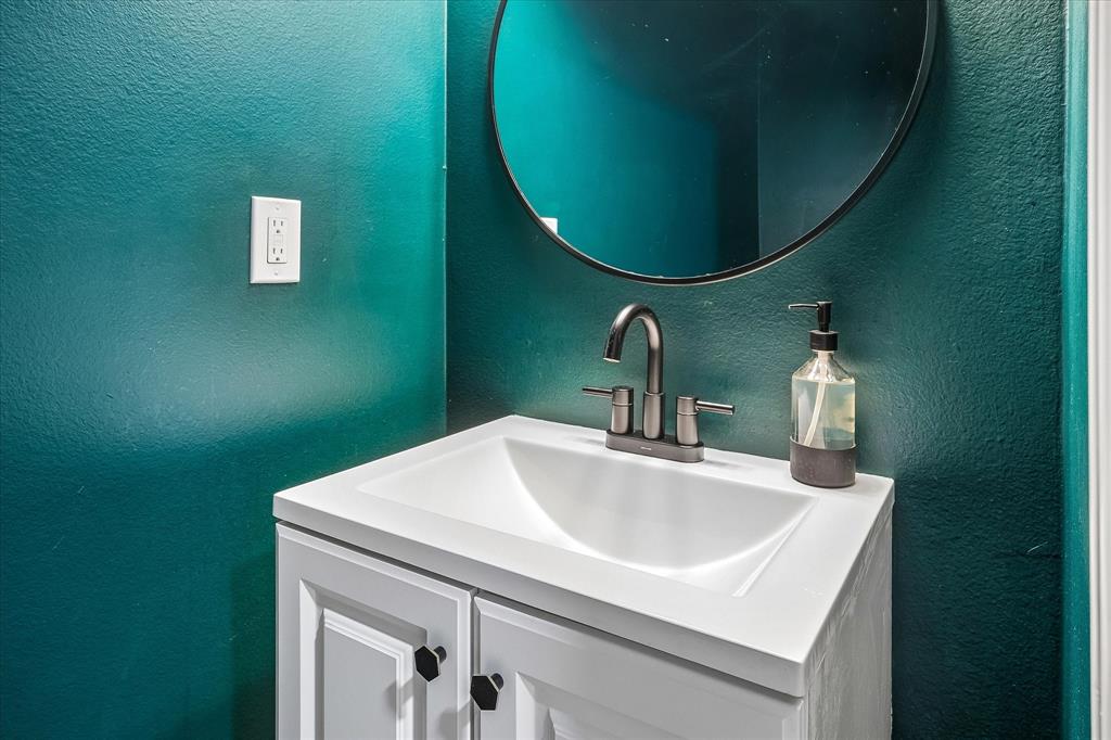 4704 Ashbrook Road Dallas, TX 75227 - Photo 20 of 33 Half Bath of the garage before you enter the kitchen