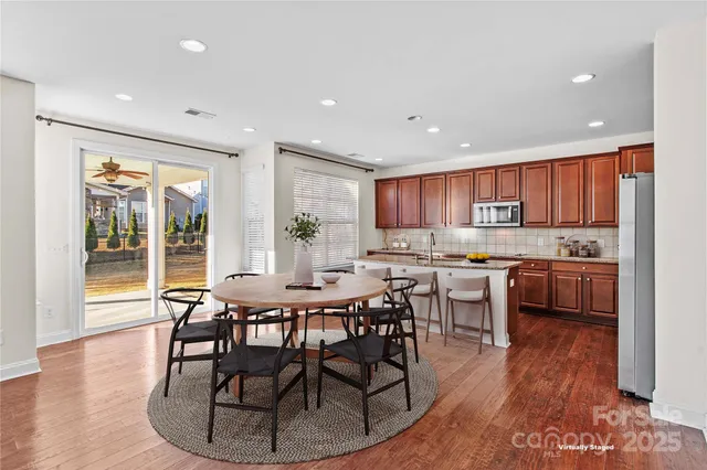 a view of a dining room with furniture window and wooden floor