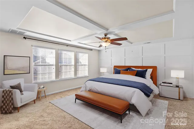a spacious bedroom with a bed and a couch