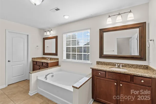 a bathroom with a sink a vanity and a mirror