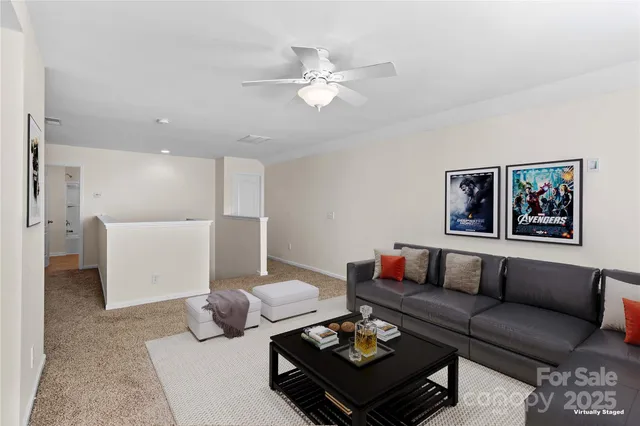 a living room with furniture and white walls