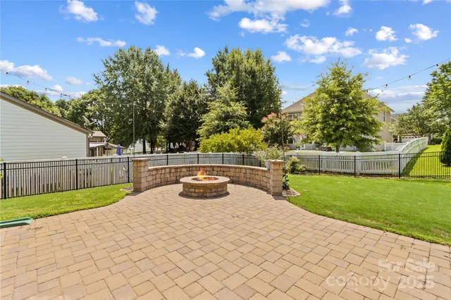 a view of a backyard with swimming pool