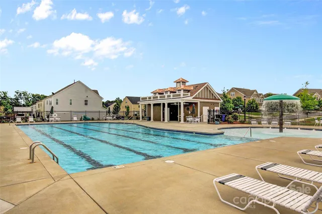 a view of a house with backyard and porch