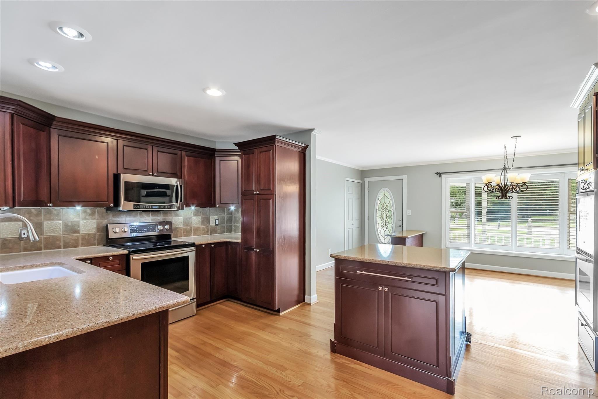 19450 Inkster Road Romulus, MI 48174 - Photo 19 of 60 KITCHEN/BUILT IN MICROWAVE/EXTRA GAS STOVE/ ADJOINS DINING ROOM