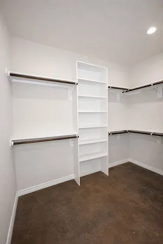 a view of an empty walk in closet