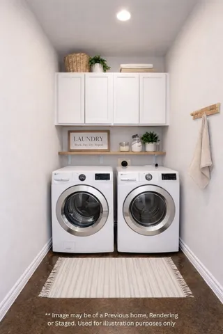 a utility room with sink dryer and washer