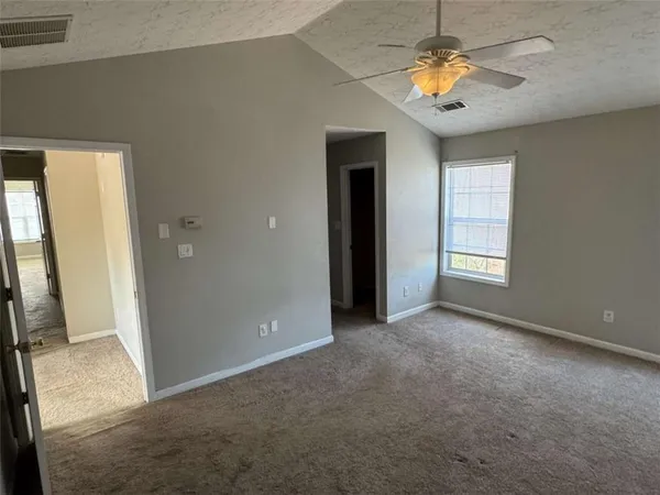 a view of an empty room and window