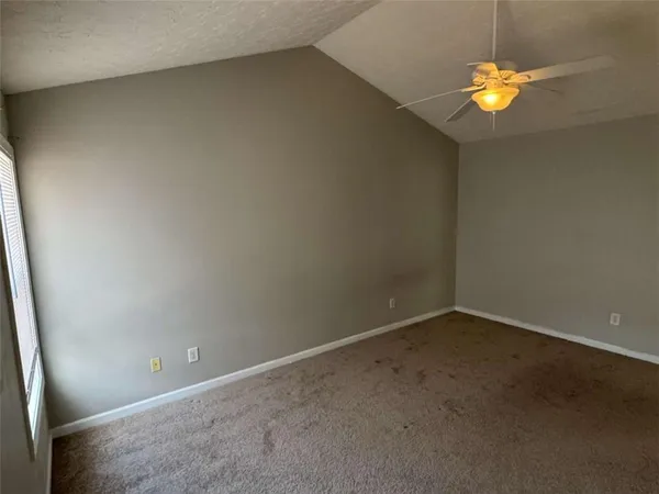 a view of a bathroom from a hallway