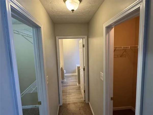 a view of a room with racks on the wall