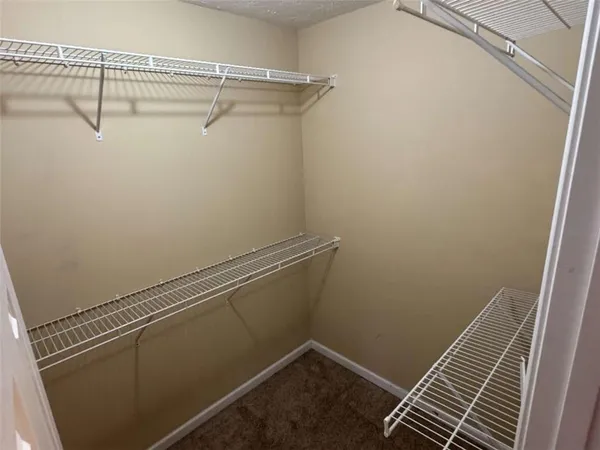 a view of a room with racks on the wall