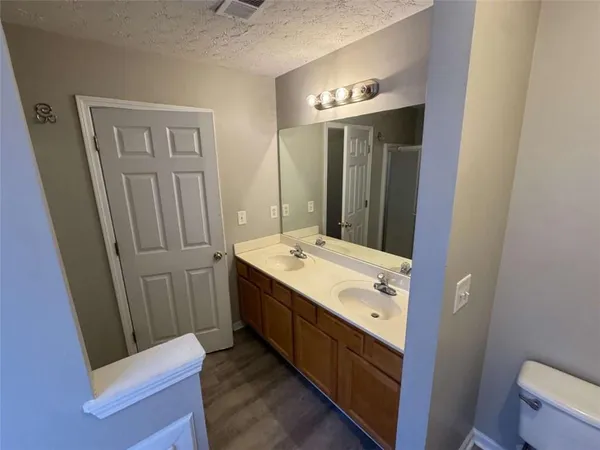 a bathroom with a bathtub and shower
