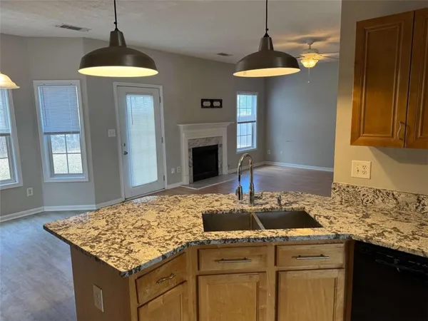 a kitchen with a sink stove and refrigerator