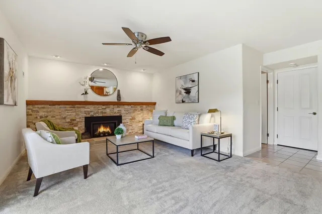 a living room with furniture and a fireplace