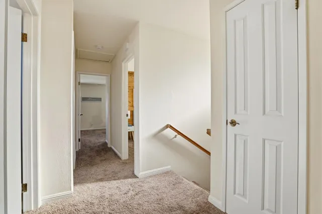 a bed room with a bed and a window