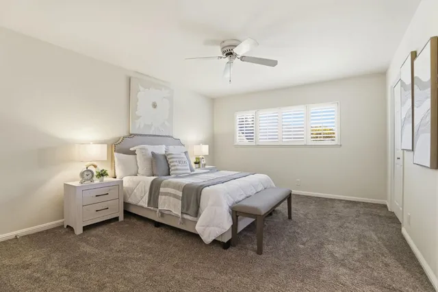 a bathroom with a toilet a sink and a mirror
