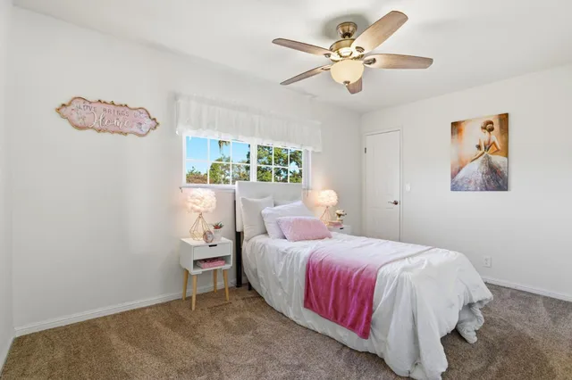 a view of a livingroom with furniture and a potted plant