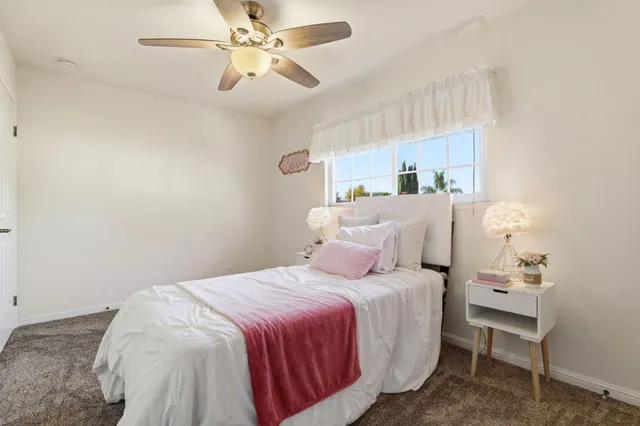 a balcony with chairs and a table
