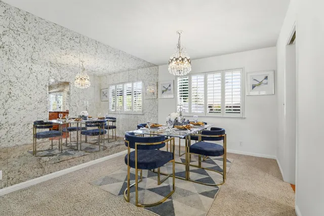 a dining room with furniture and window