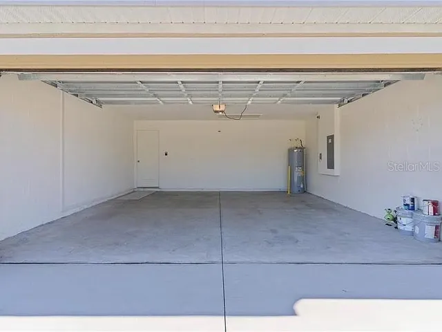 a view of a house with backyard porch and garden