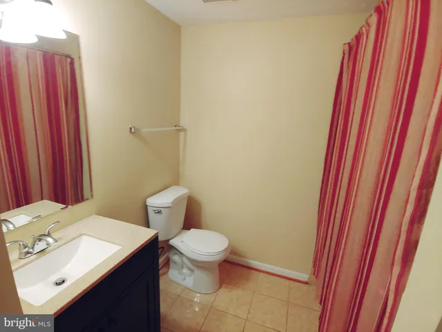 a bathroom with a sink and toilet