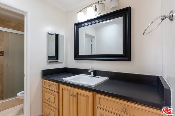 a bathroom with a shower and a toilet