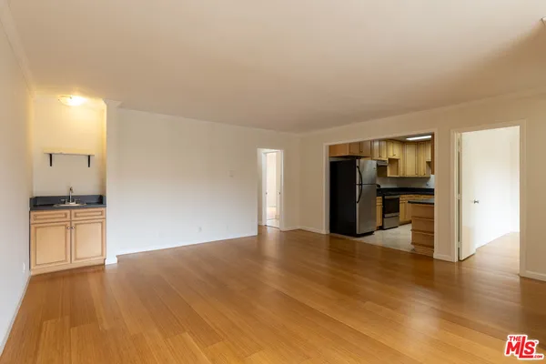 a view of a kitchen with a sink and a stove top oven