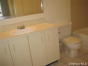 a bathroom with a sink and toilet