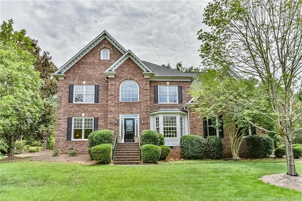 325 Kimberly Road Davidson, NC 28036 - Photo 1 of 22 a front view of a house with a yard and green space