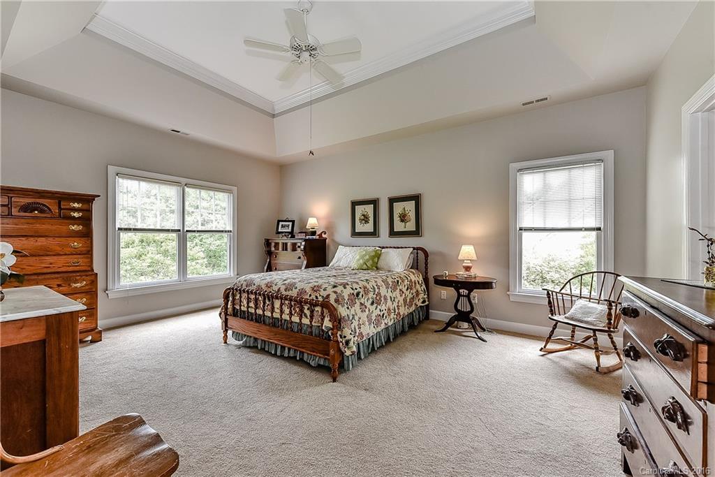 325 Kimberly Road Davidson, NC 28036 - Photo 12 of 22 a spacious bedroom with a bed and a window