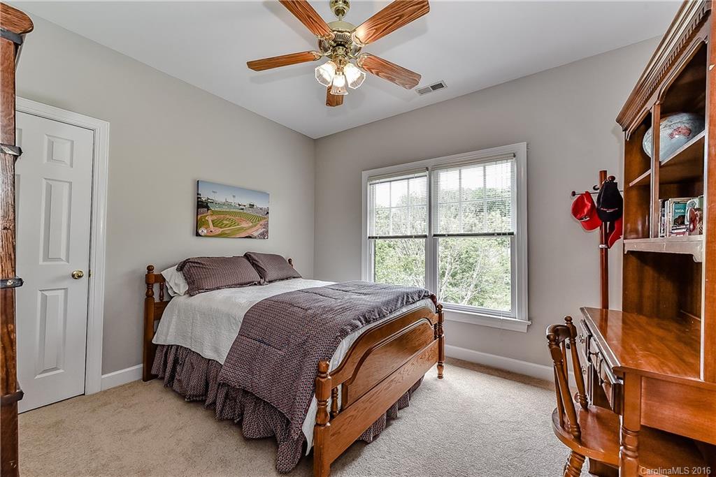 325 Kimberly Road Davidson, NC 28036 - Photo 13 of 22 a bed room with a bed and a window
