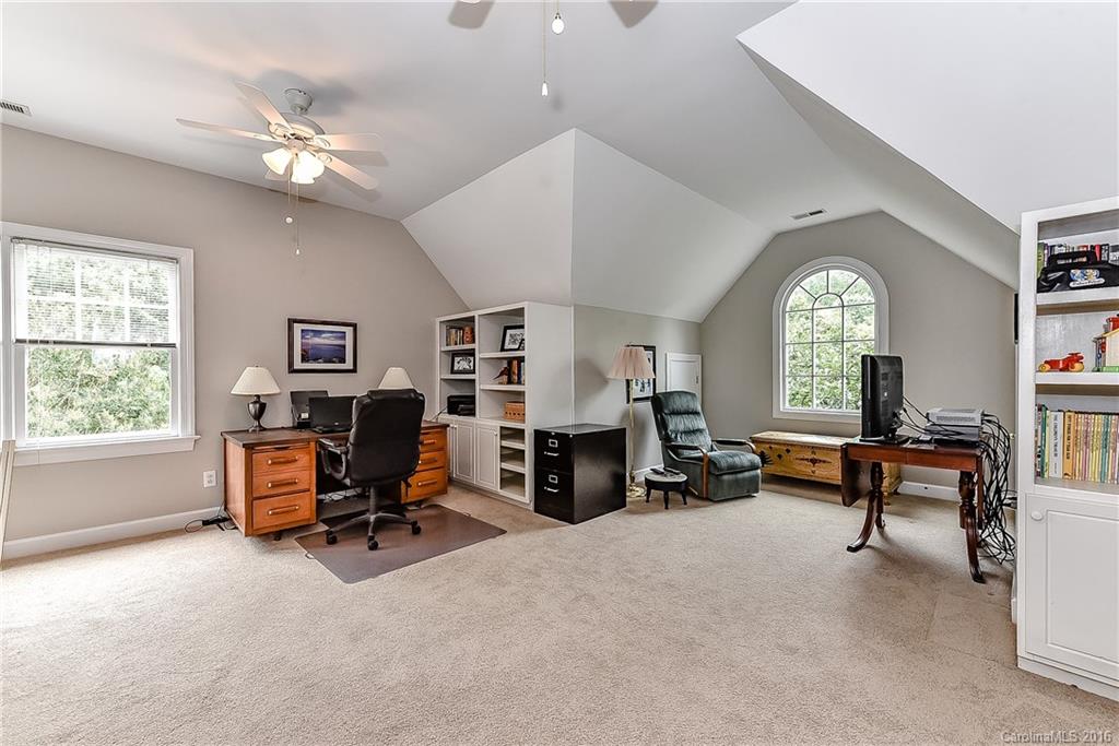 325 Kimberly Road Davidson, NC 28036 - Photo 14 of 22 a living room with furniture and a chandelier