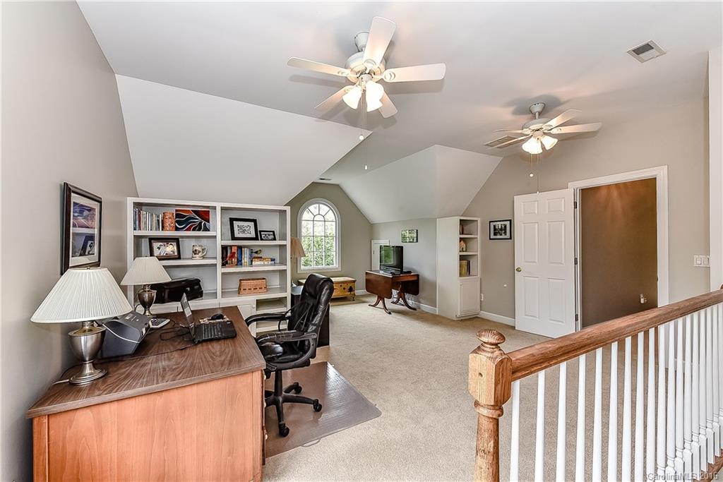 325 Kimberly Road Davidson, NC 28036 - Photo 15 of 22 a view of a workspace with furniture and a window