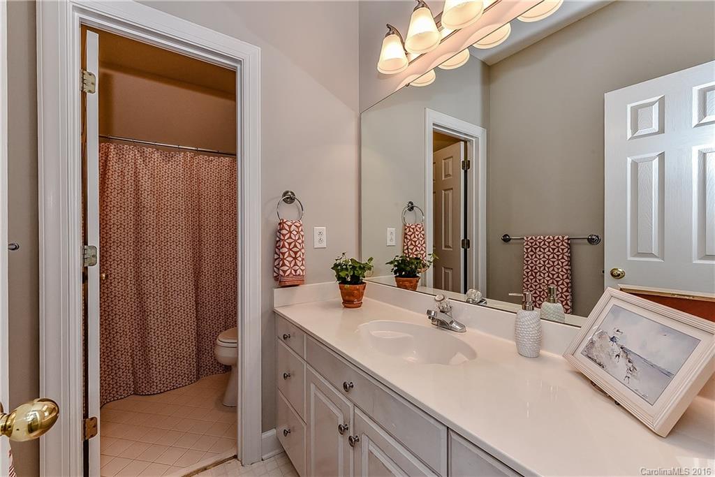 325 Kimberly Road Davidson, NC 28036 - Photo 16 of 22 a bathroom with a double vanity sink and a mirror