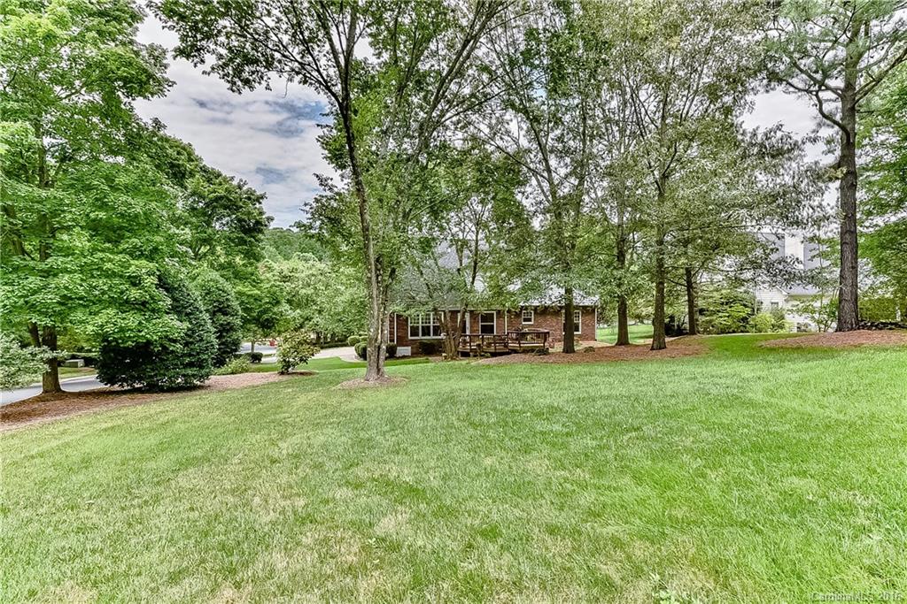 325 Kimberly Road Davidson, NC 28036 - Photo 21 of 22 a view of a park with large trees