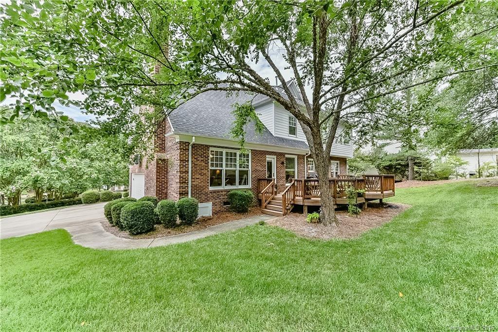 325 Kimberly Road Davidson, NC 28036 - Photo 22 of 22 a view of a chair and table in backyard of the house