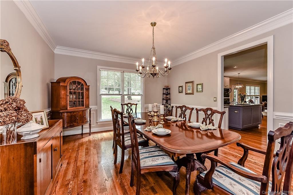 325 Kimberly Road Davidson, NC 28036 - Photo 5 of 22 a view of a dining room with furniture window and wooden floor
