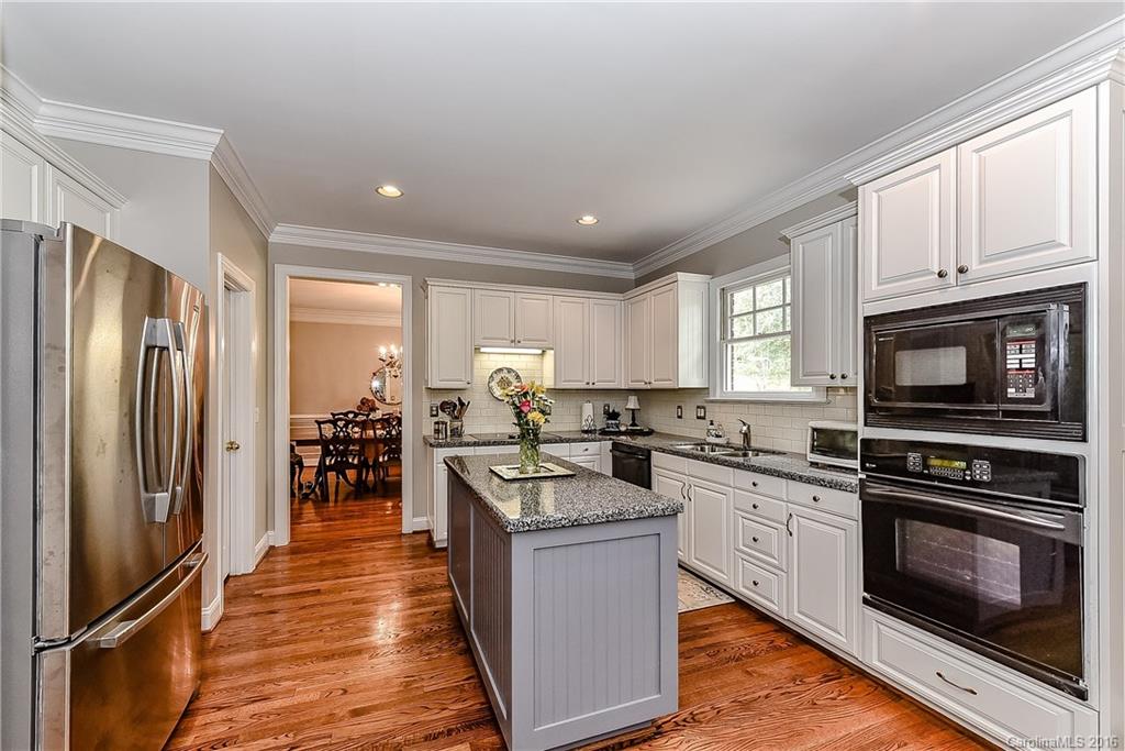 325 Kimberly Road Davidson, NC 28036 - Photo 8 of 22 a kitchen with cabinets and stainless steel appliances